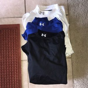 White, blue, and black Under Armour long sleeves